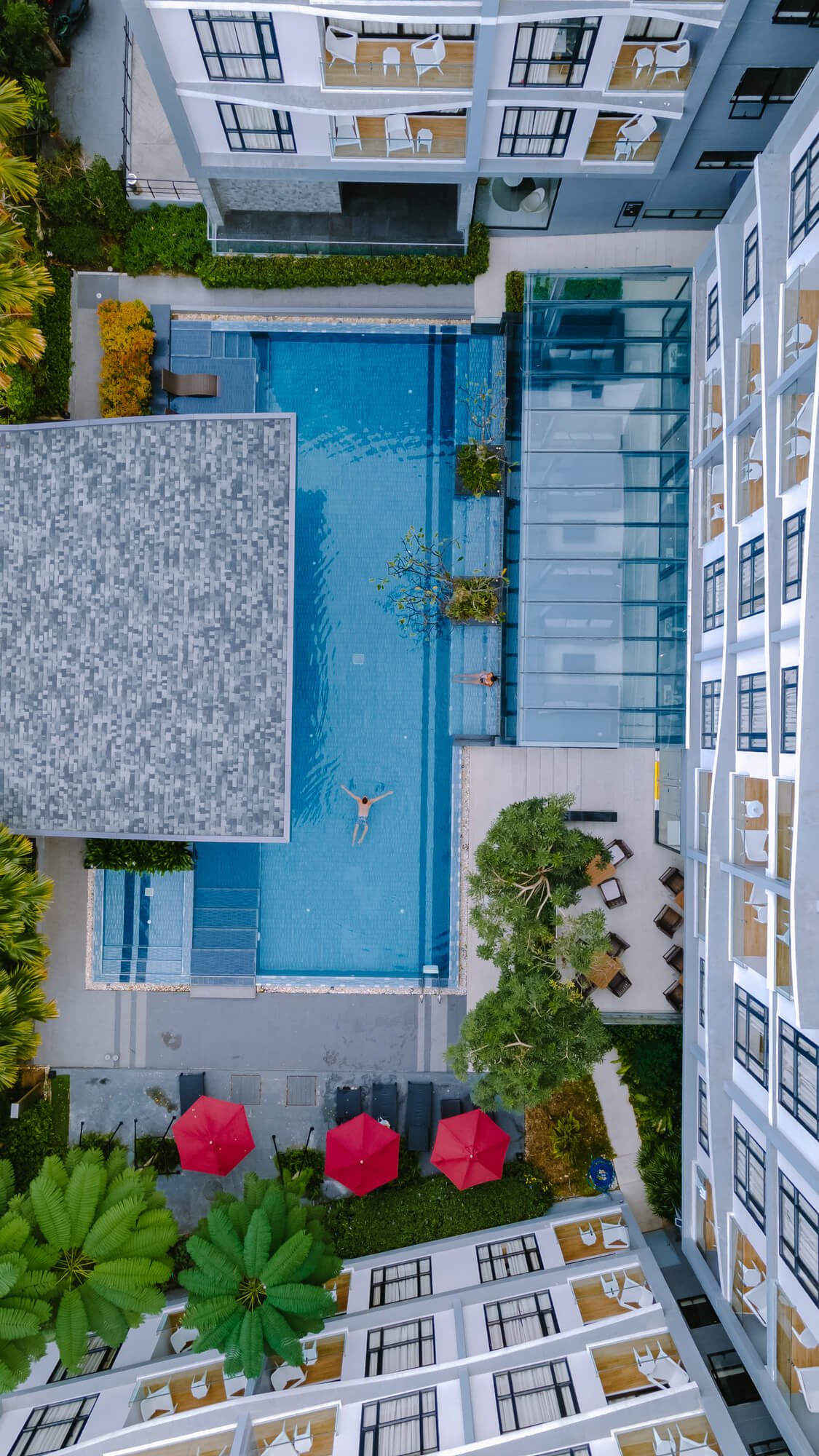 drone view from above at swimming pool couple men 2023 11 27 04 55 04 utc.jpg